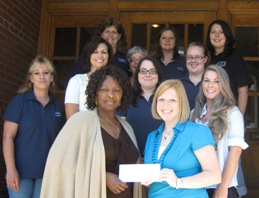 Ambassador Club members and advisors presenting the check to the director of the Johnstown Financial Literacy program